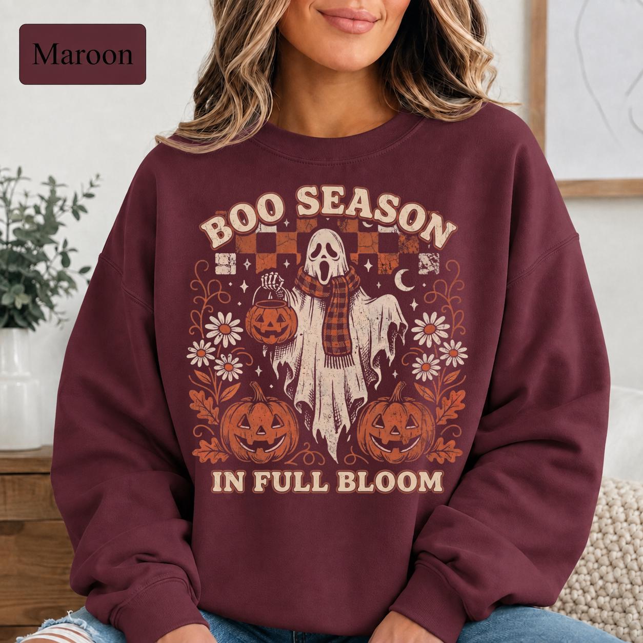 intage-inspired Halloween crewneck featuring ghost, pumpkin bucket, daisies, crescent moon, and stars.