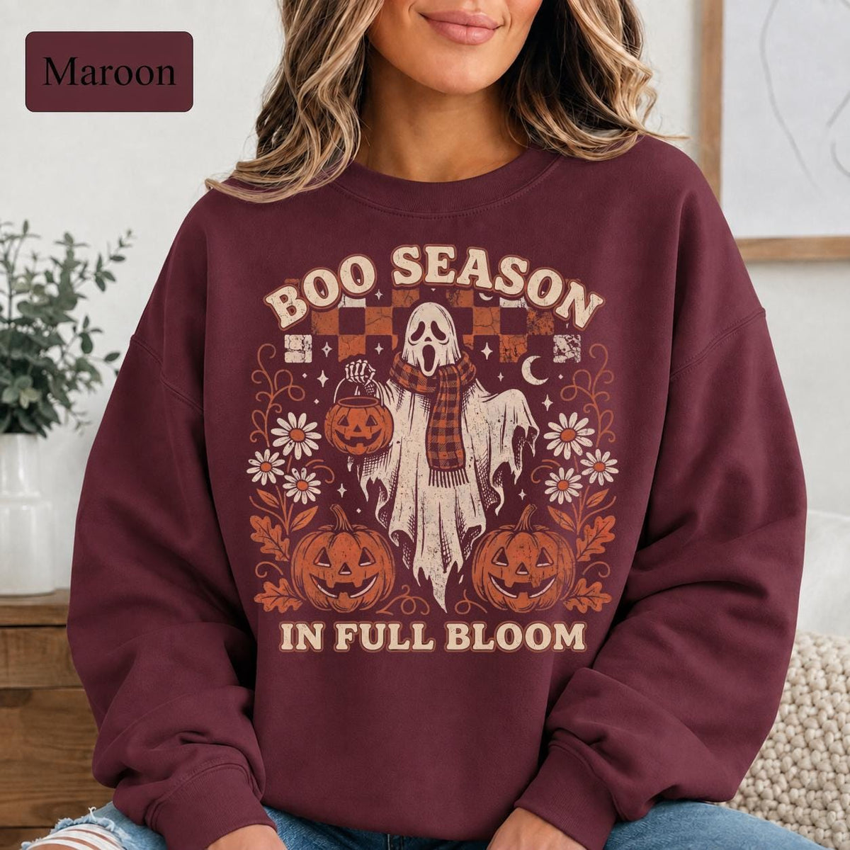 intage-inspired Halloween crewneck featuring ghost, pumpkin bucket, daisies, crescent moon, and stars.