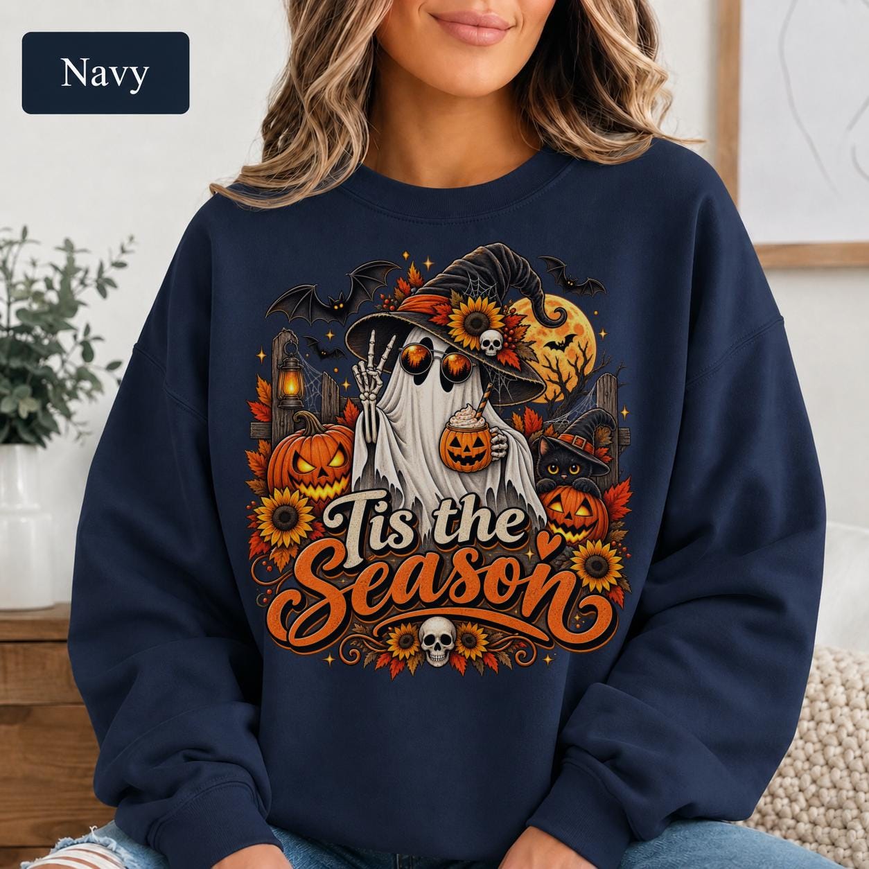 Halloween lover sweatshirt with ghost, black cat, jack-o-lanterns, sunflowers, bats, and witchy accents.