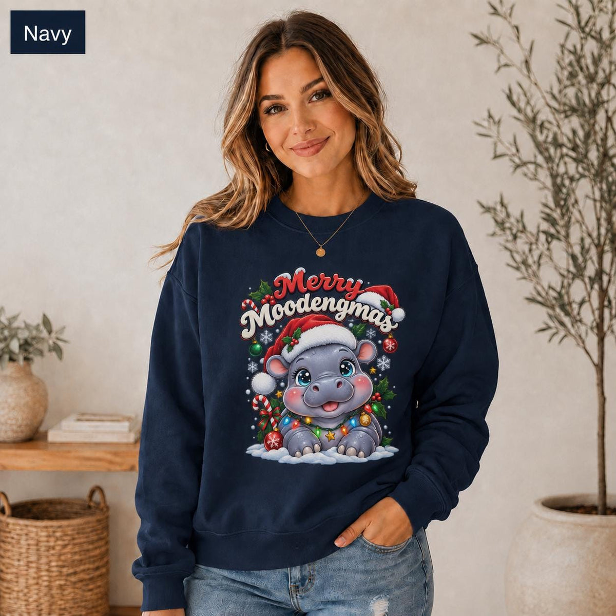 Navy Christmas sweatshirt featuring a cute hippo in a Santa hat with Merry Moodengmas text, candy canes, ornaments, holly, and snowflakes.