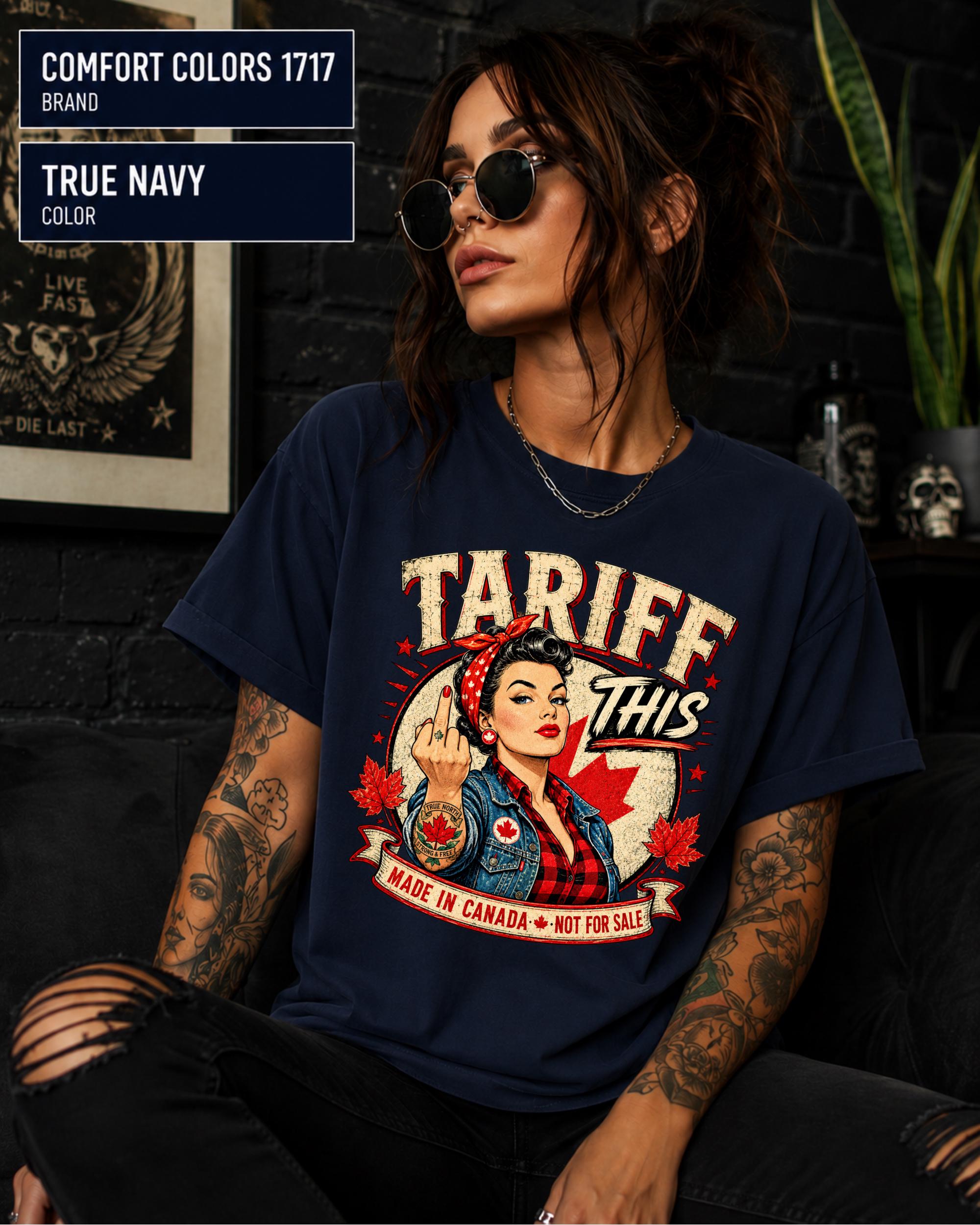 Woman wearing a True navy Comfort Colors 1717 shirt with Tariff This text, Canadian flag, maple leaves, and retro pin-up artwork.