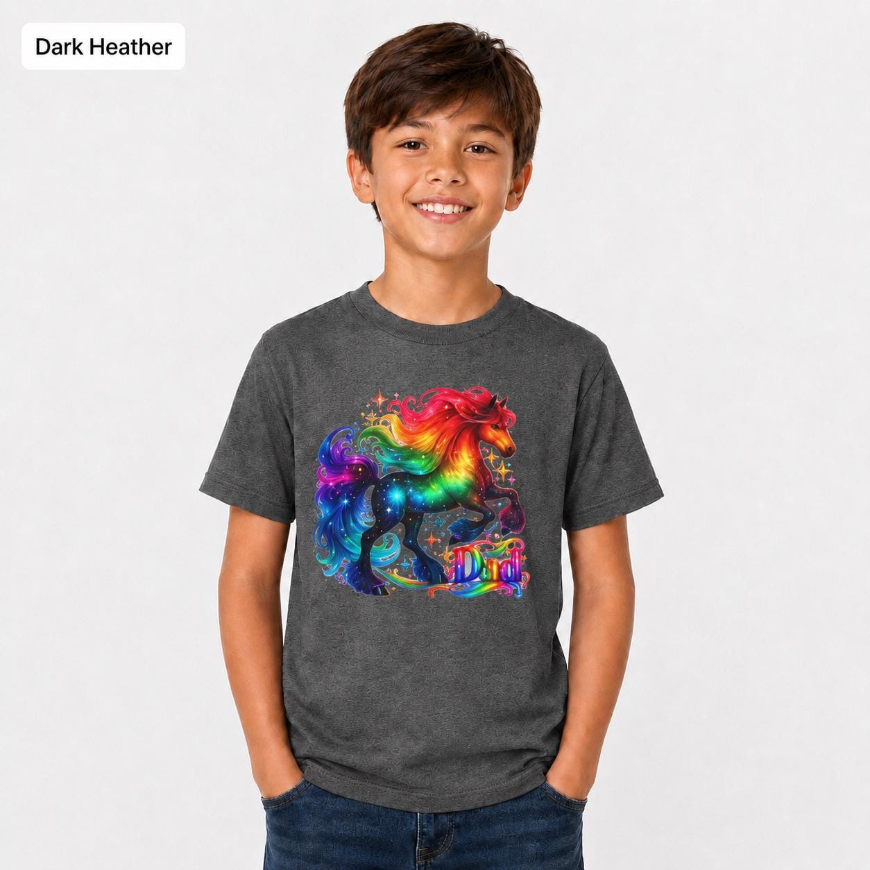 Dark heather youth T-shirt mockup showing a bold rainbow unicorn design on a child wearing a Gildan 5000B tee.