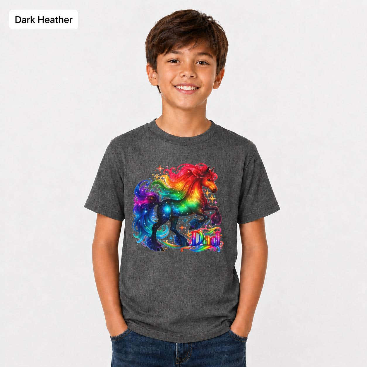 Dark heather youth T-shirt mockup showing a bold rainbow unicorn design on a child wearing a Gildan 5000B tee.