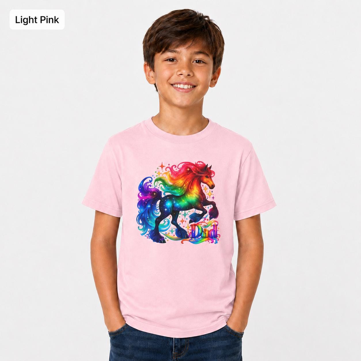 Light pink Gildan 5000B kids shirt featuring a colorful unicorn rainbow graphic in a clean studio mockup.