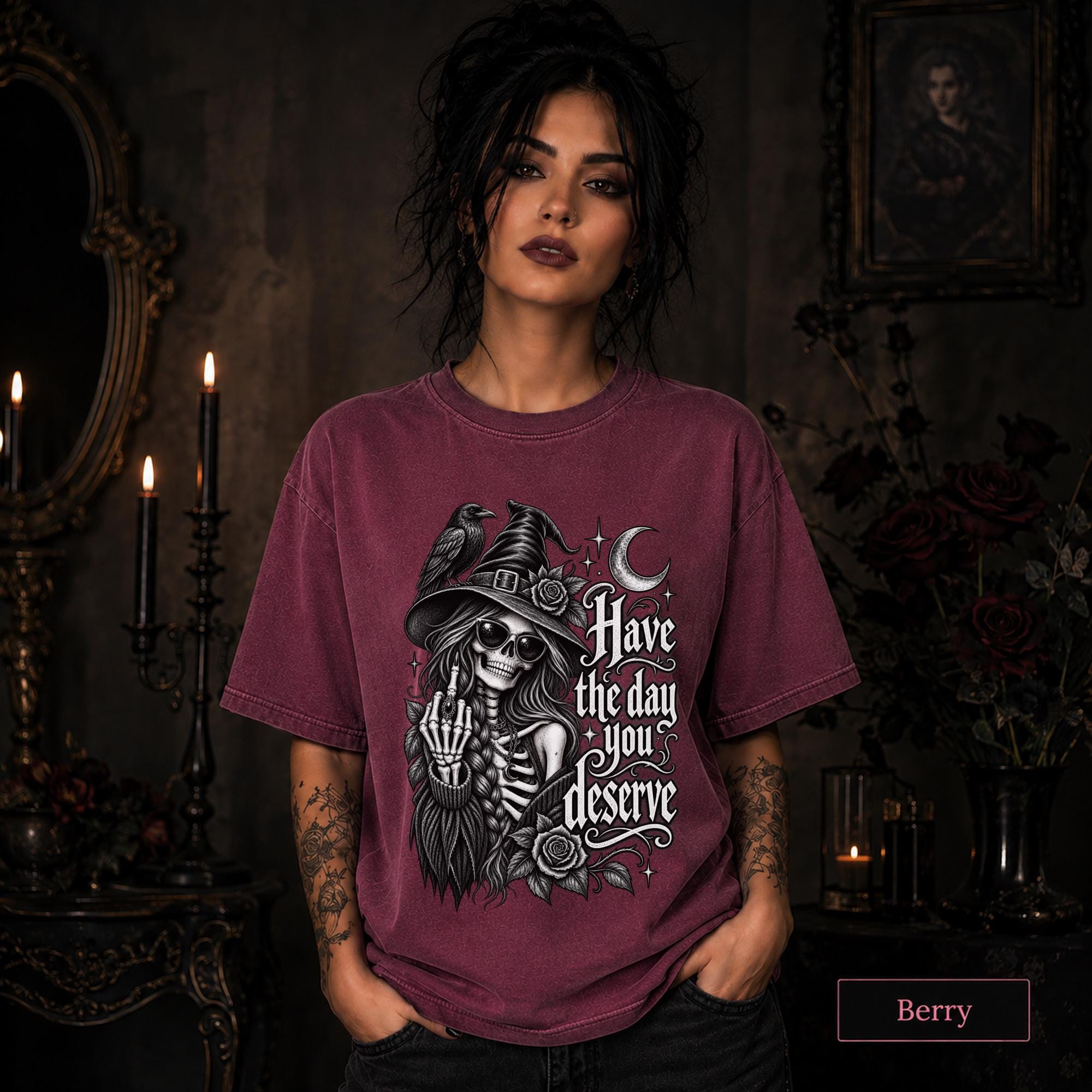 Dark humor women’s tee with skeleton witch, black raven, roses, stars, and crescent moon illustration.