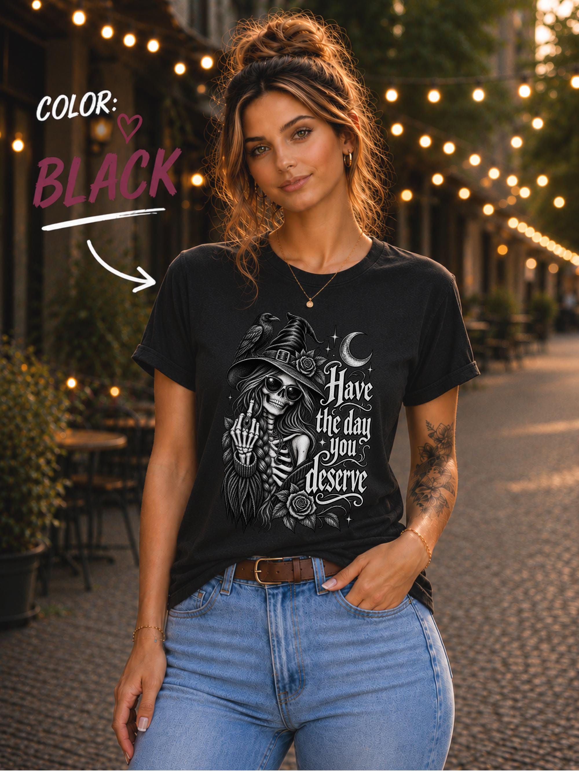 Dark aesthetic graphic tee featuring raven, skeleton woman, crescent moon, flowers, and celestial stars.