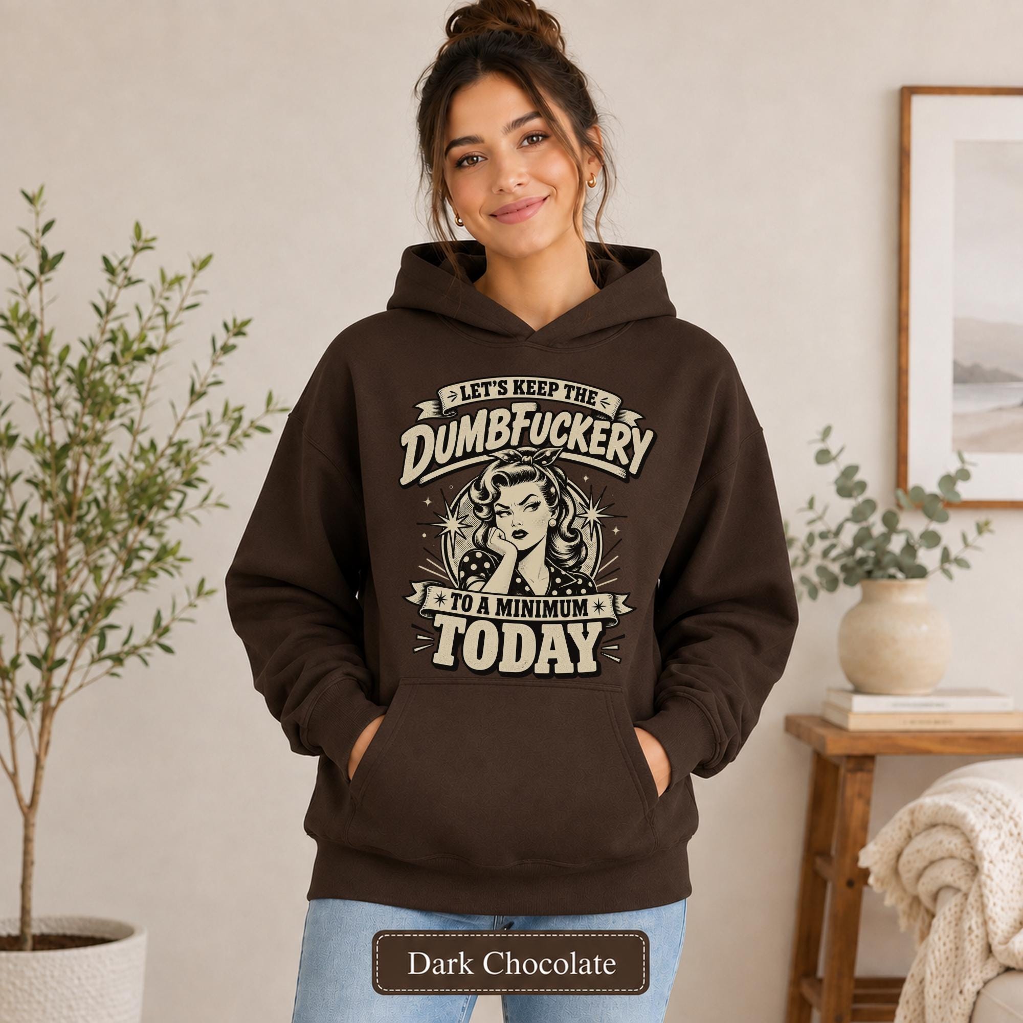 Woman wearing a dark chocolate Gildan 18500 hoodie with blank front, kangaroo pocket, relaxed unisex fit, and dark heather color label.