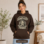 Woman wearing a dark chocolate Gildan 18500 hoodie with blank front, kangaroo pocket, relaxed unisex fit, and dark heather color label.
