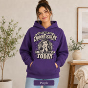Female model wearing a purple Gildan 18500 hooded sweatshirt with blank chest area, front pocket, and purple color name.