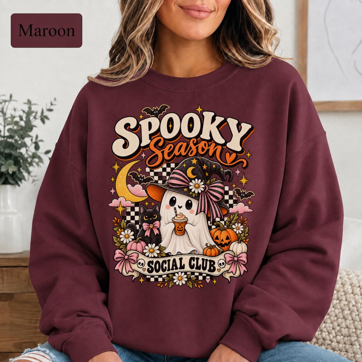 Retro Halloween sweatshirt featuring crescent moon, stars, bats, checkerboard details, and jack-o-lanterns.