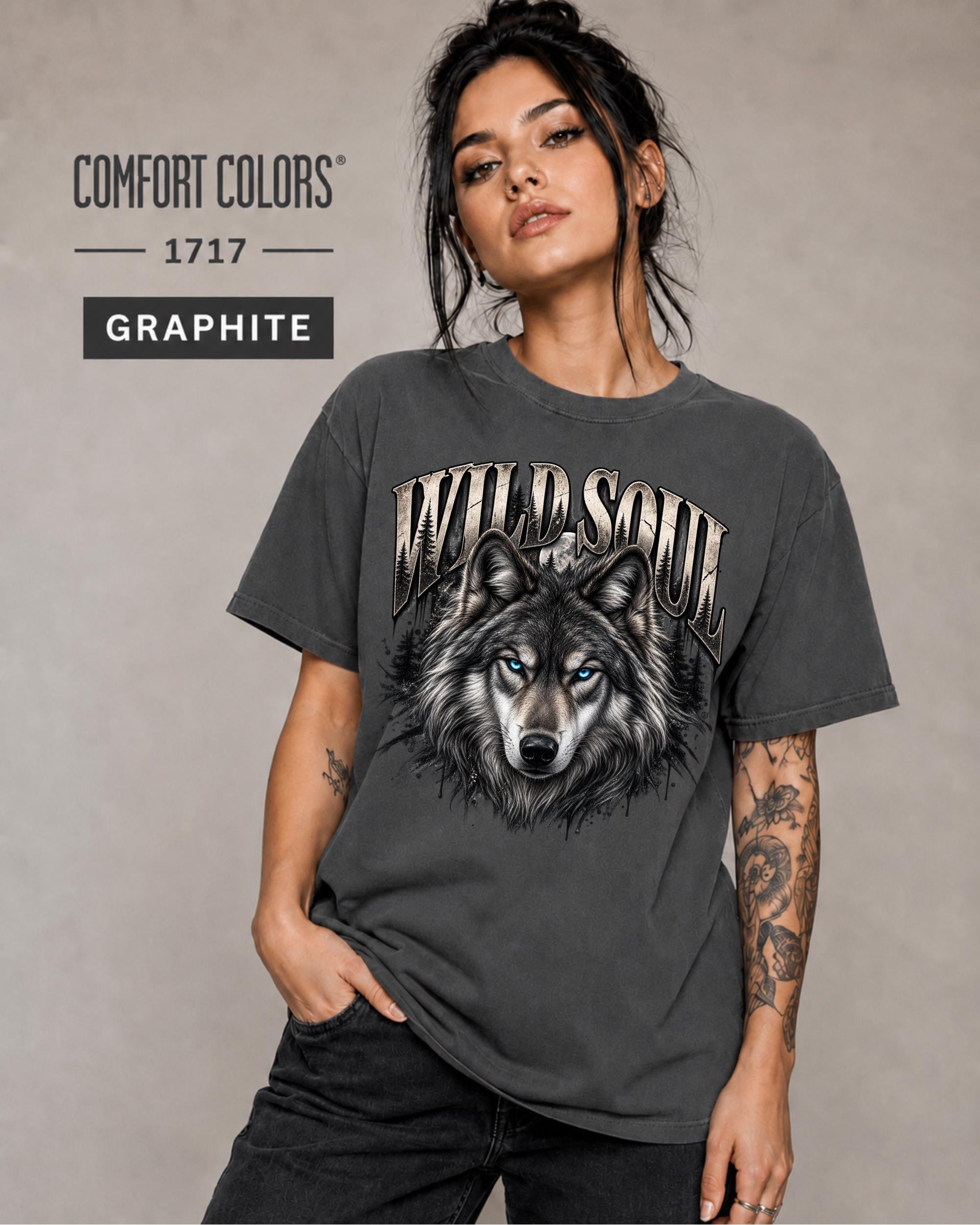 Wild Soul wolf graphic Comfort Colors 1717 T-shirt in graphite featuring a detailed gray wolf with bright blue eyes and forest-inspired artwork.