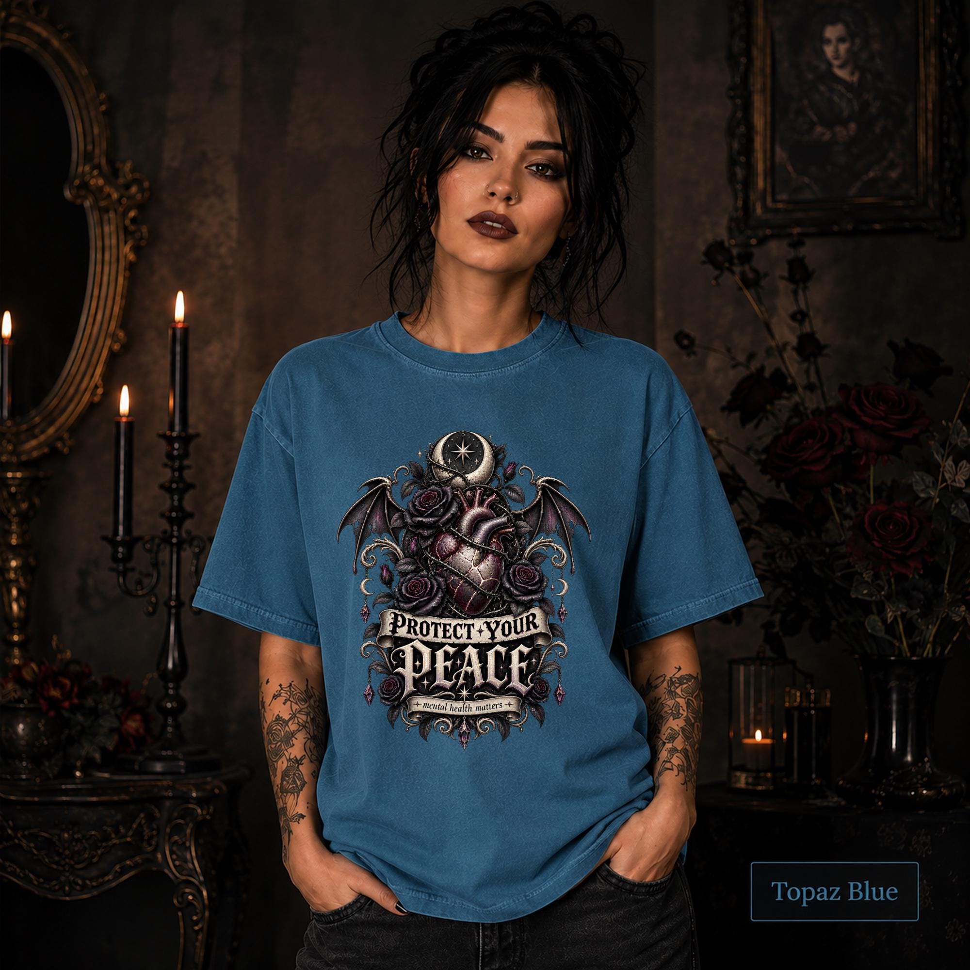 Protect Your Peace gothic topaz blue T-shirt featuring an anatomical heart, dark roses, bat wings, crescent moon, and mental health matters artwork.