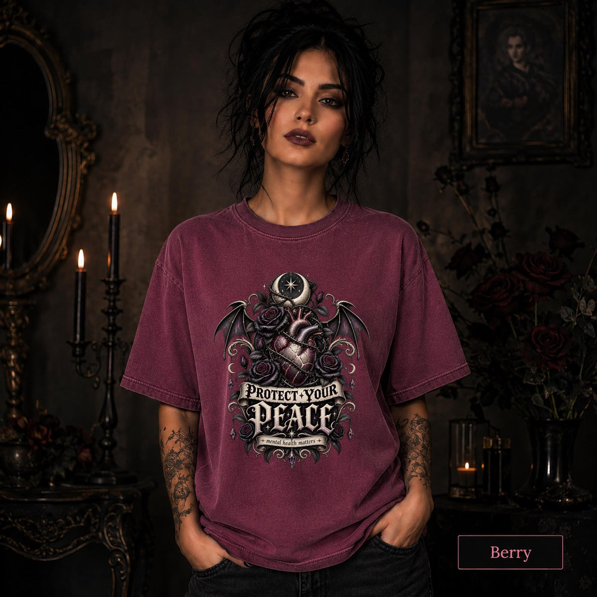Protect Your Peace gothic berry T-shirt featuring an anatomical heart, dark roses, bat wings, crescent moon, and mental health matters artwork.