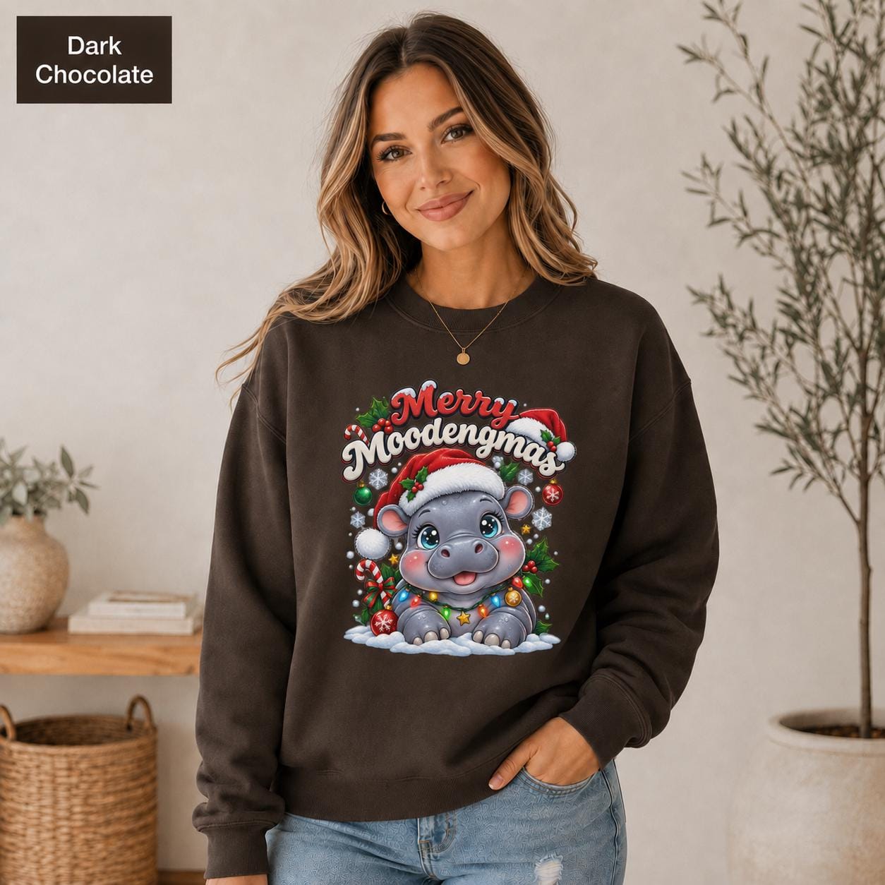 Dark Chocolate Christmas sweatshirt featuring a cute hippo in a Santa hat with Merry Moodengmas text, candy canes, ornaments, holly, and snowflakes.