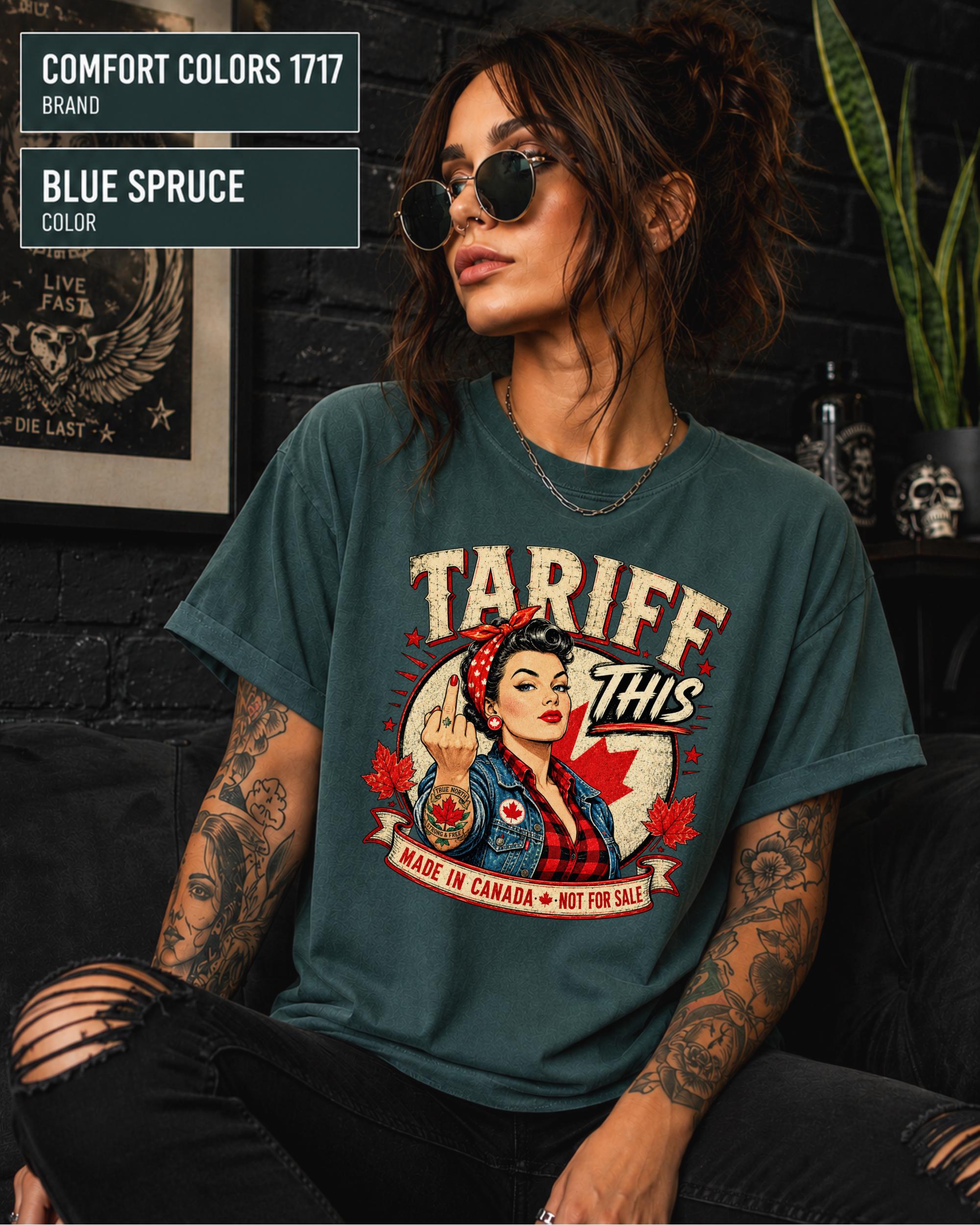 Woman wearing a Blue Spruce Comfort Colors 1717 shirt with Tariff This text, Canadian flag, maple leaves, and retro pin-up artwork.