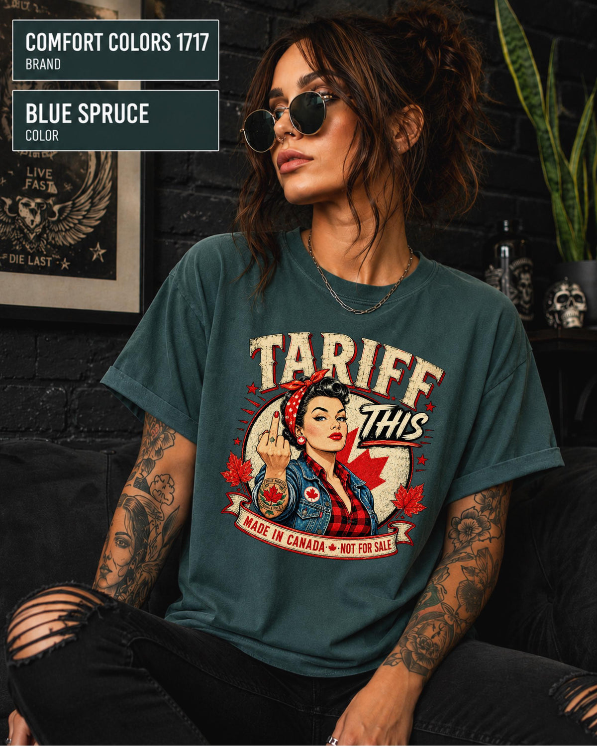 Woman wearing a Blue Spruce Comfort Colors 1717 shirt with Tariff This text, Canadian flag, maple leaves, and retro pin-up artwork.