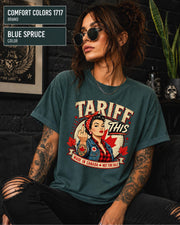 Woman wearing a Blue Spruce Comfort Colors 1717 shirt with Tariff This text, Canadian flag, maple leaves, and retro pin-up artwork.