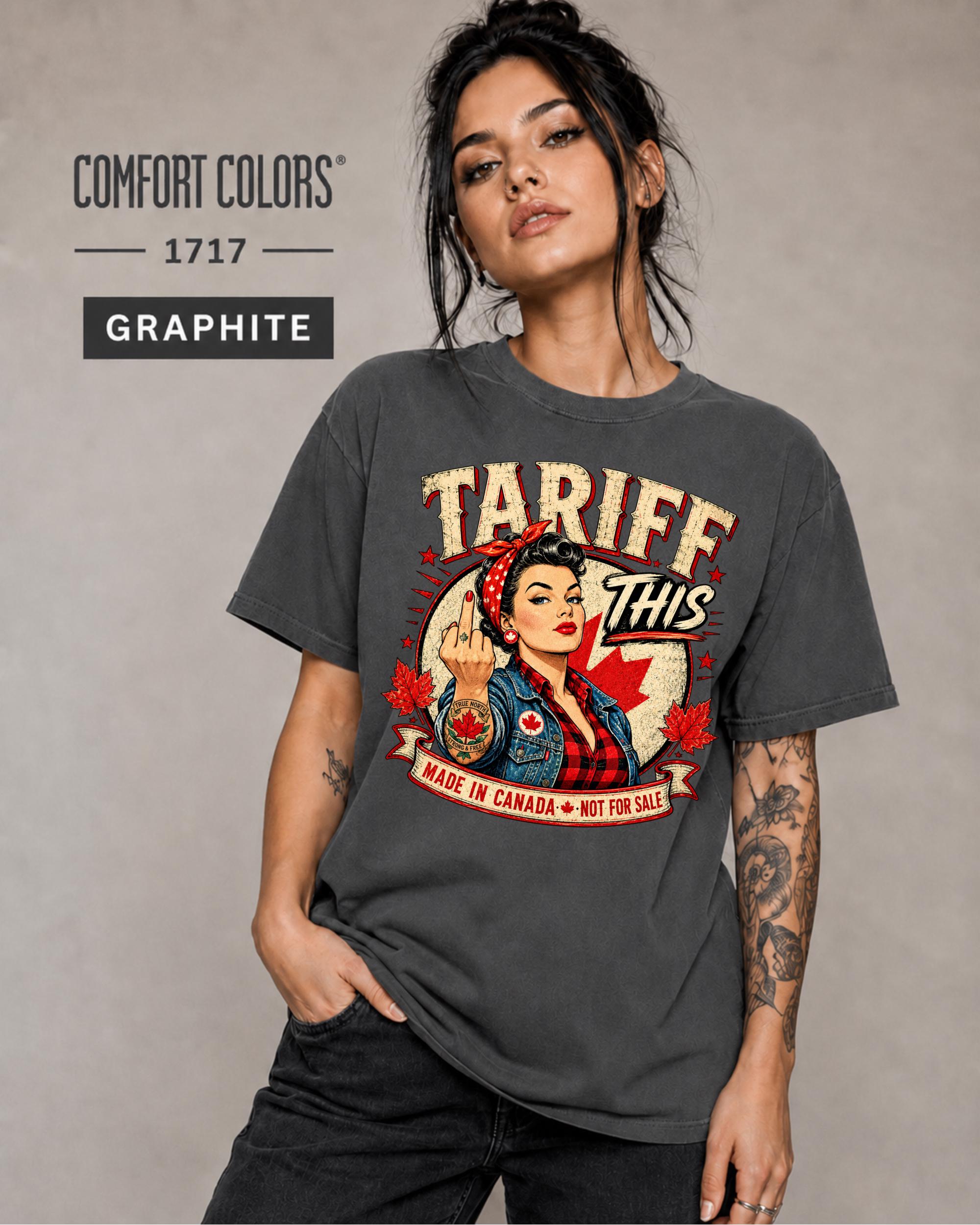 Woman wearing a Graphite Comfort Colors 1717 shirt with Tariff This text, Canadian flag, maple leaves, and retro pin-up artwork.