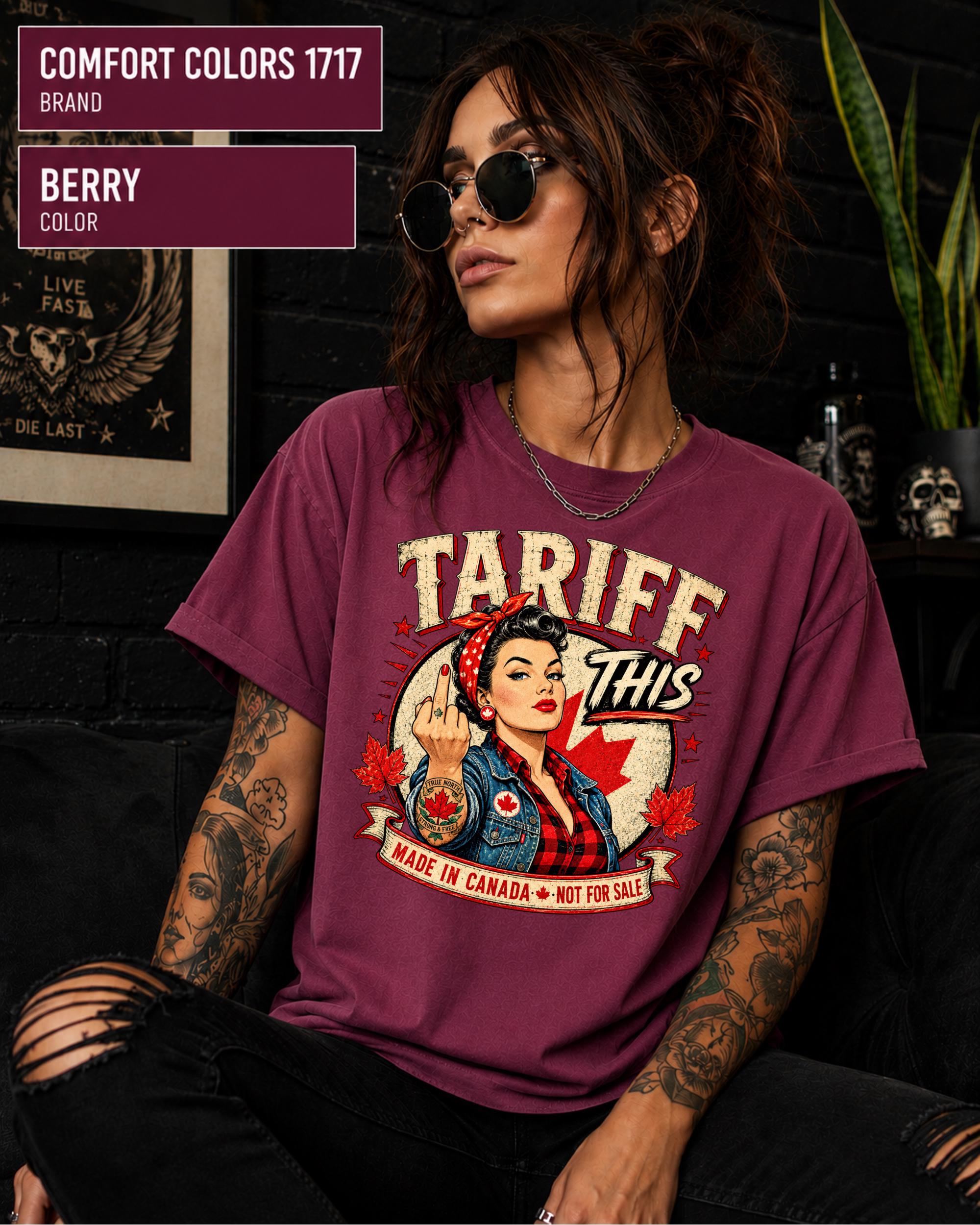 Woman wearing a Berry Comfort Colors 1717 shirt with Tariff This text, Canadian flag, maple leaves, and retro pin-up artwork.