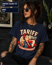 Woman wearing a Navy Comfort Colors 1717 shirt with Tariff This text, Canadian flag, maple leaves, and retro pin-up artwork.