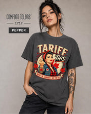 Woman wearing a Pepper Comfort Colors 1717 shirt with Tariff This text, Canadian flag, maple leaves, and retro pin-up artwork.