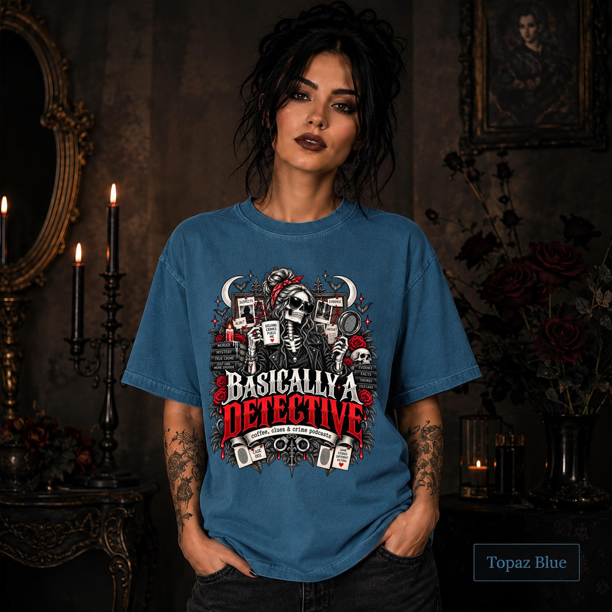 Basically a Detective topaz blue graphic T-shirt featuring a skeleton investigator, evidence board, magnifying glass, red roses, case files, and true crime artwork.