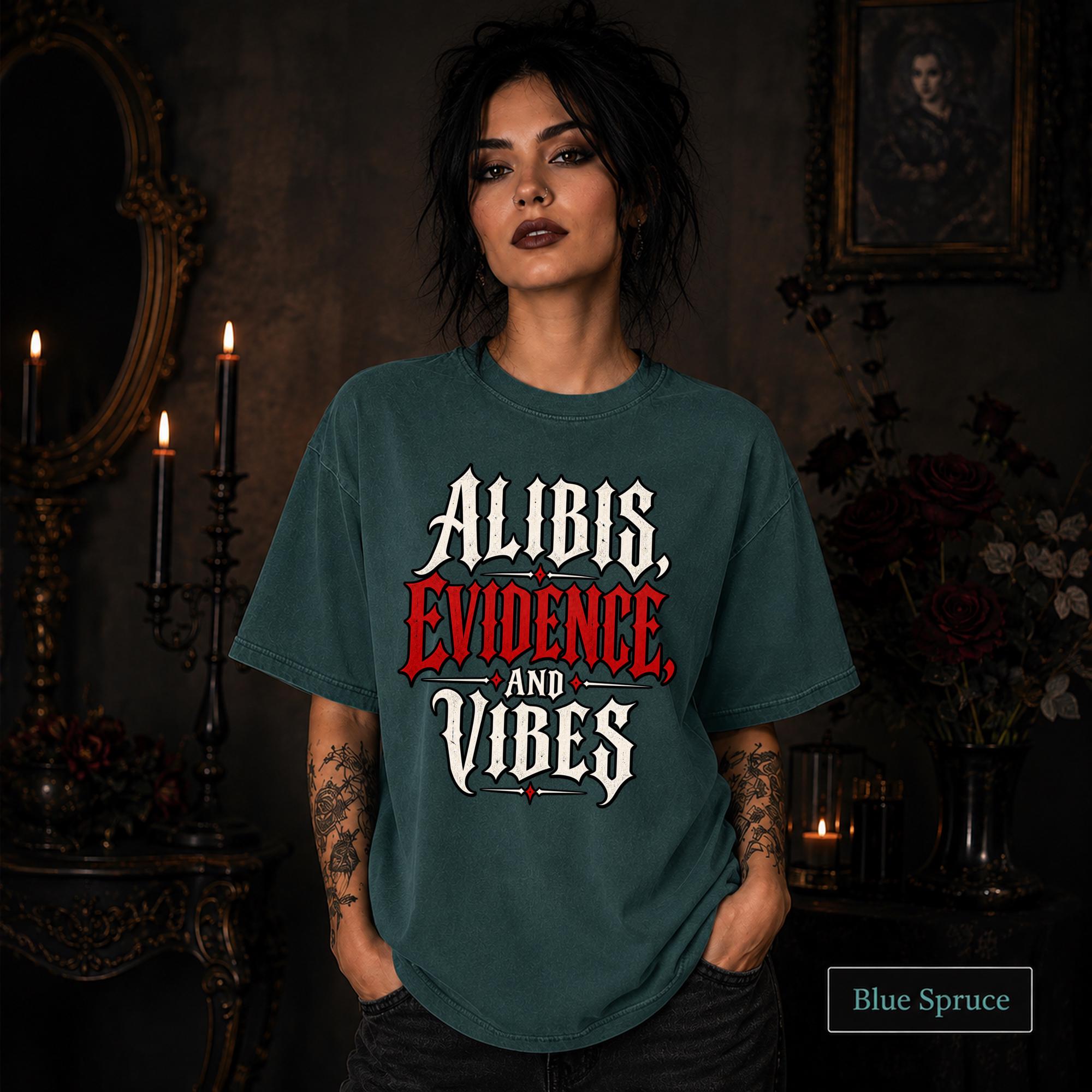 Alibis Evidence and Vibes graphic T-shirt in blue spruce featuring bold red and white gothic lettering on a dark unisex tee.