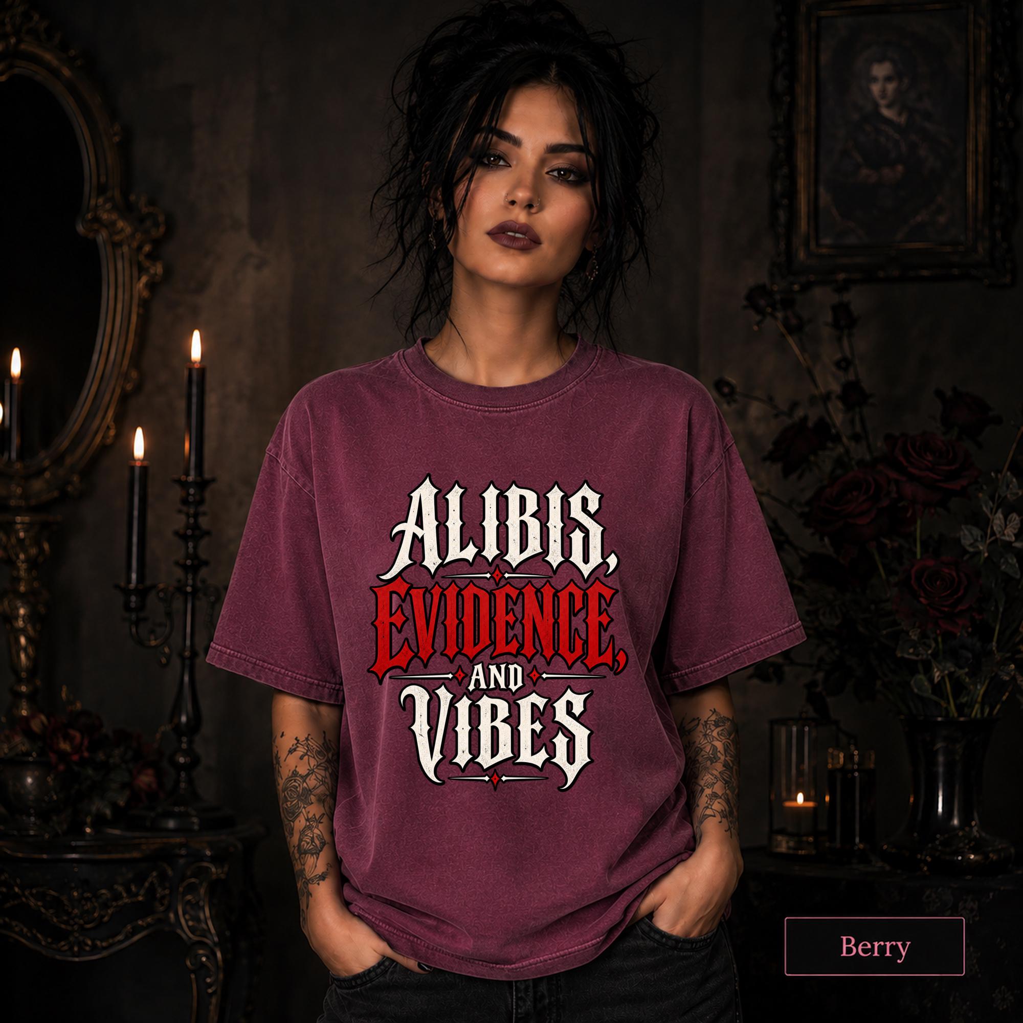 Alibis Evidence and Vibes graphic T-shirt in berry featuring bold red and white gothic lettering on a dark unisex tee.