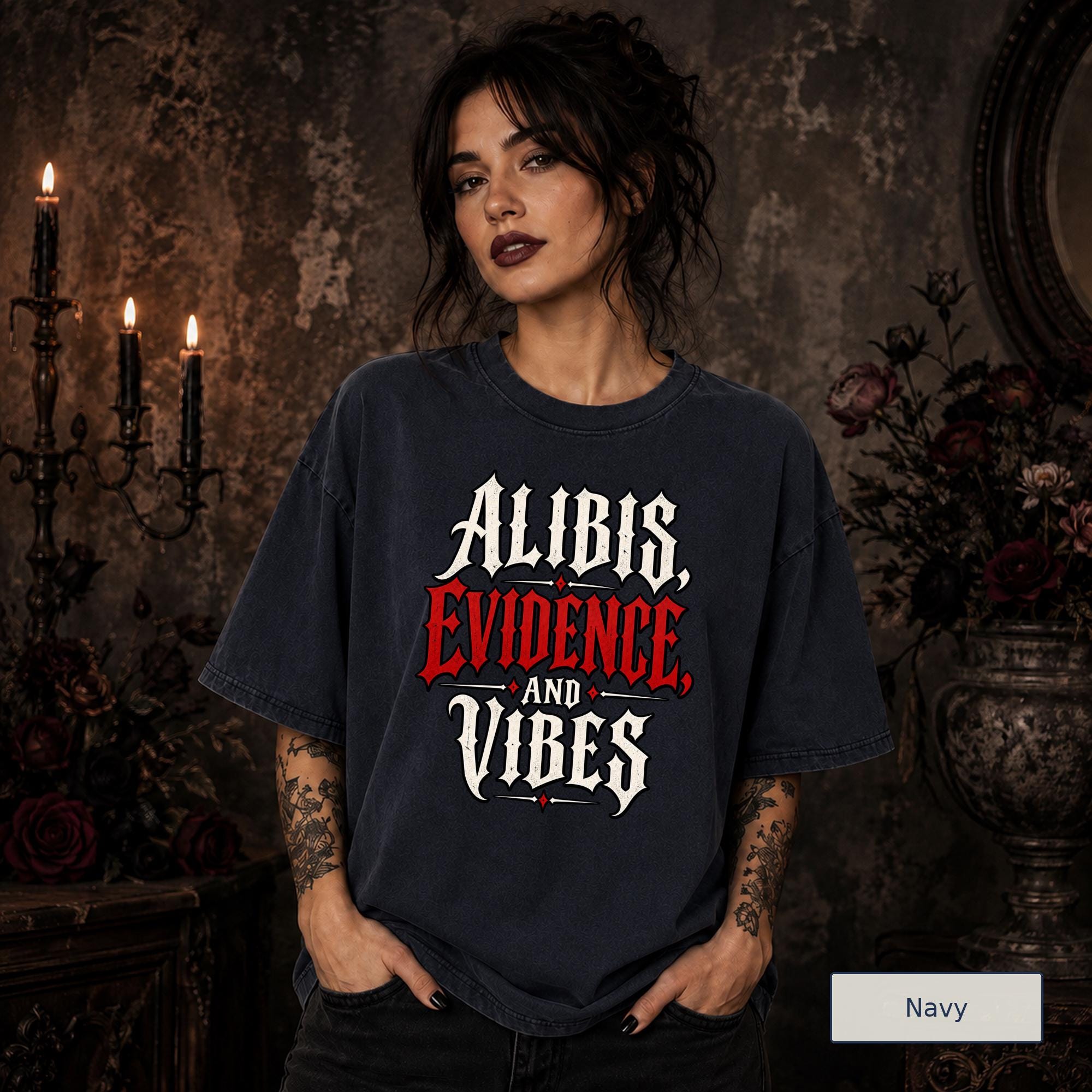 Alibis Evidence and Vibes graphic T-shirt in navy featuring bold red and white gothic lettering on a dark unisex tee.