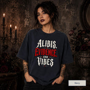 Alibis Evidence and Vibes graphic T-shirt in navy featuring bold red and white gothic lettering on a dark unisex tee.
