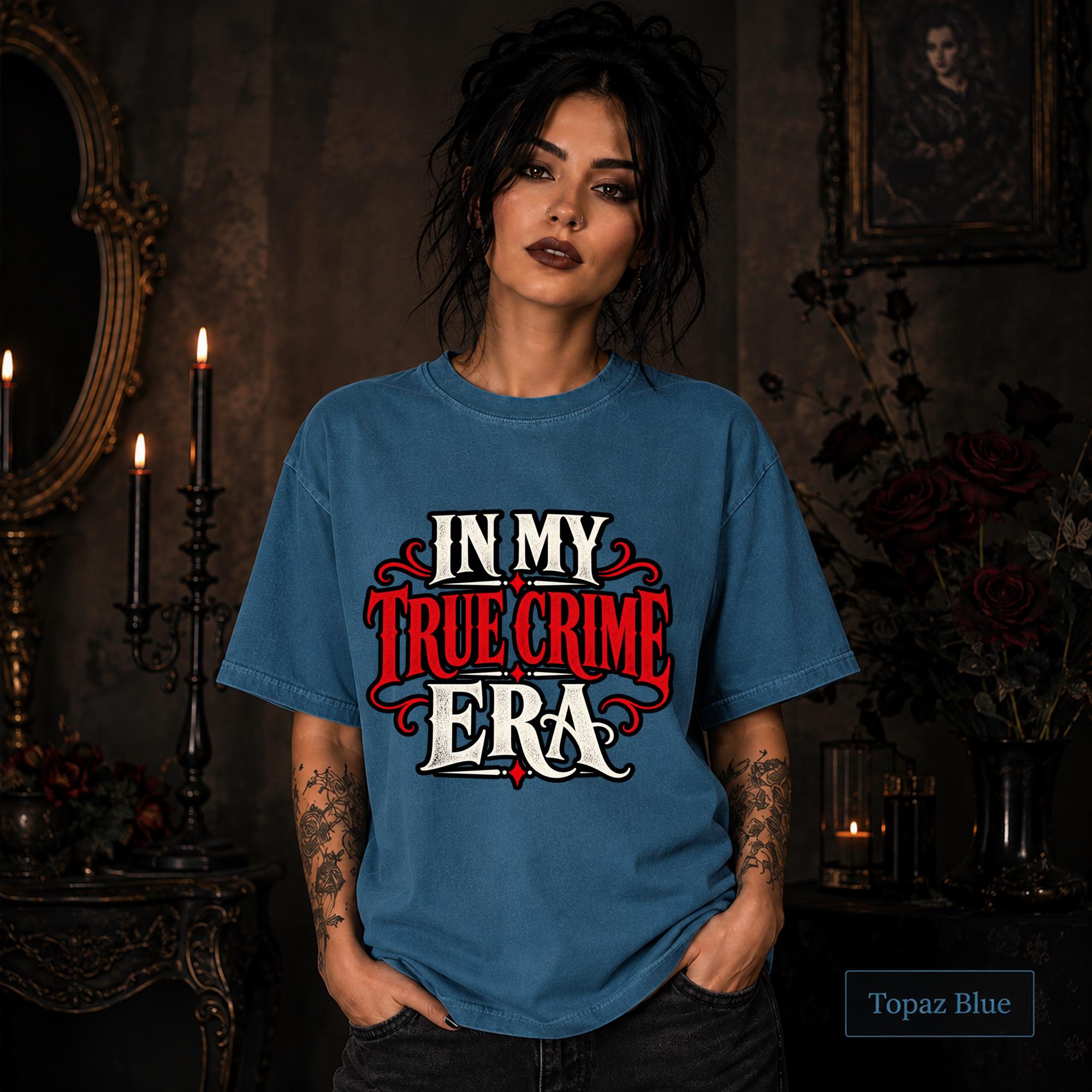 In My True Crime Era topaz blue T-shirt featuring bold red and white gothic lettering in a simple true crime graphic design.