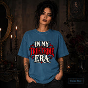 In My True Crime Era topaz blue T-shirt featuring bold red and white gothic lettering in a simple true crime graphic design.