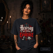 Hearsay Isn’t Justice Evidence Is midnight T-shirt featuring red and white gothic lettering, scales of justice, and a judge’s gavel.