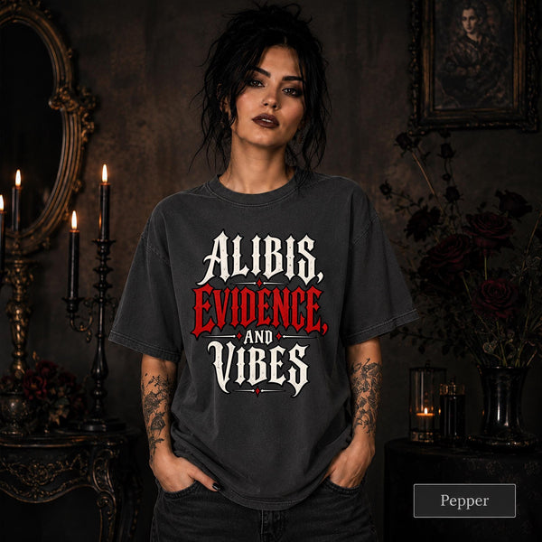 Alibis Evidence and Vibes graphic T-shirt in pepper featuring bold red and white gothic lettering on a dark unisex tee.