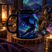 Aurora dragon black ceramic mug in 11 oz and 15 oz sizes featuring a fantasy dragon, northern lights, moon, mountains, and vivid night sky artwork.