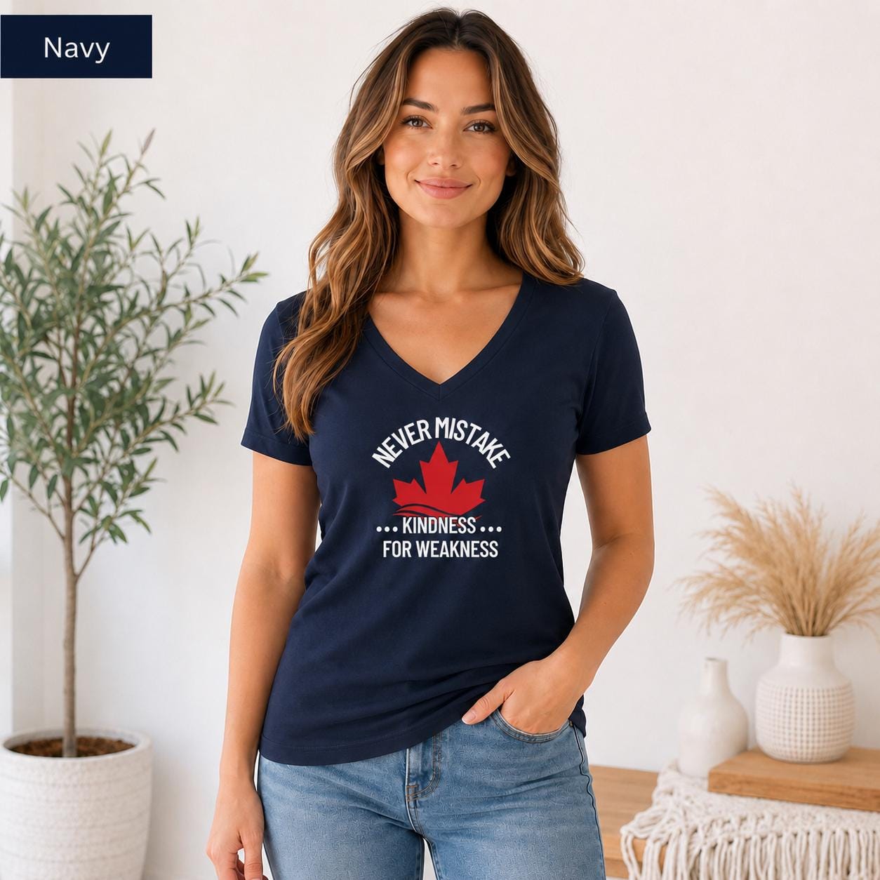 Navy Bella Canvas 3005 V-neck tee on female model with Canadian maple leaf and kindness statement graphic.