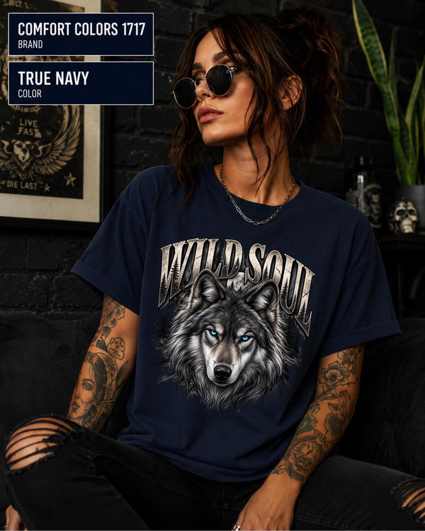 Wild Soul wolf graphic Comfort Colors 1717 T-shirt in true navy featuring a detailed gray wolf with bright blue eyes and forest-inspired artwork.