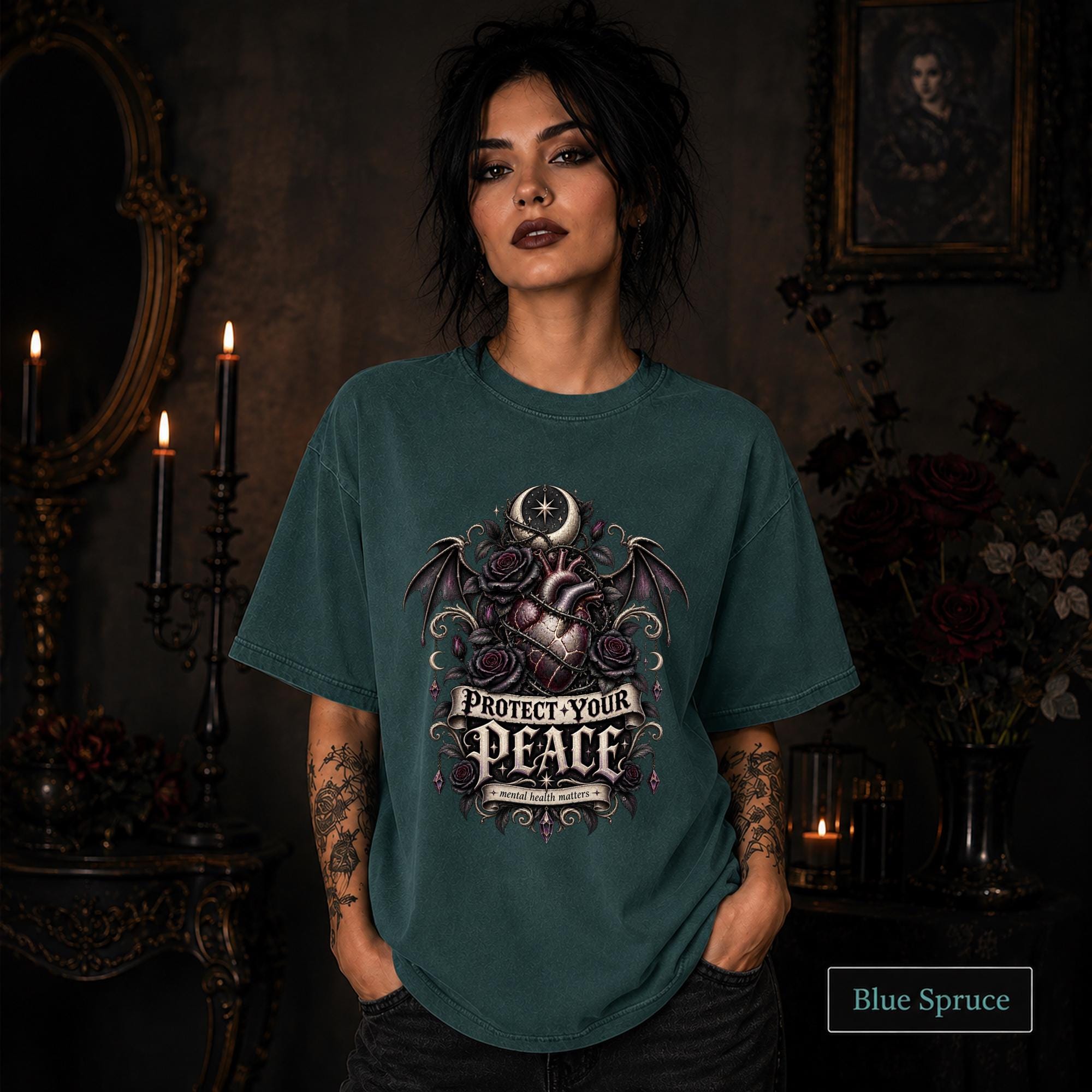 Protect Your Peace gothic blue spruce T-shirt featuring an anatomical heart, dark roses, bat wings, crescent moon, and mental health matters artwork.