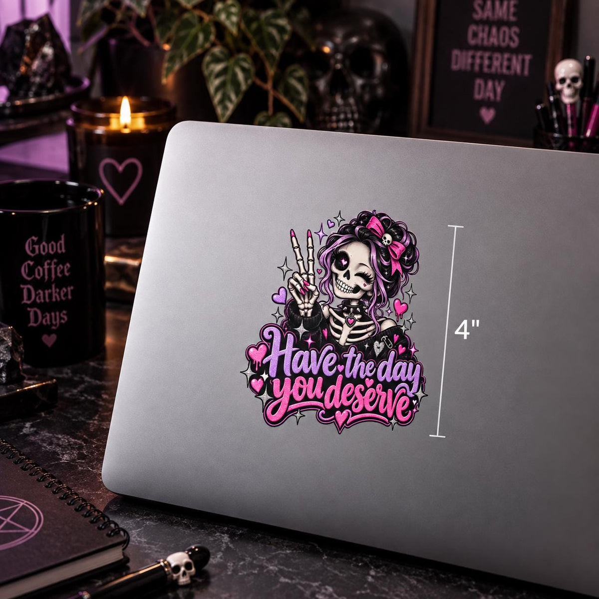 Close-up laptop mockup featuring the Have the Day You Deserve UV DTF decal with skeleton girl, pink bow, hearts, sparkles, and peace sign.