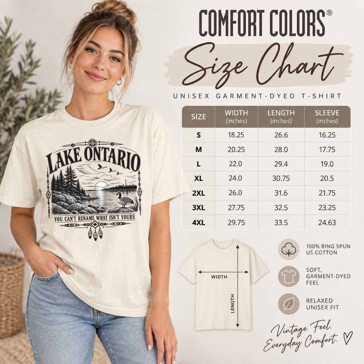 Size chart Comfort Colors Lake Ontario T-shirt featuring a black vintage shoreline design with pine trees, rocky waterfront, Canada goose, Indigenous-inspired geometric details, and the phrase You Can’t Rename What Isn’t Yours.
