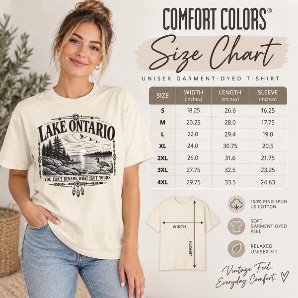 Size chart Comfort Colors Lake Ontario T-shirt featuring a black vintage shoreline design with pine trees, rocky waterfront, Canada goose, Indigenous-inspired geometric details, and the phrase You Can’t Rename What Isn’t Yours.