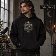 Black unisex hoodie shown from the front with a smaller Midnight Naturalist Society bird skull emblem centered on the chest in a dark academia inspired style.