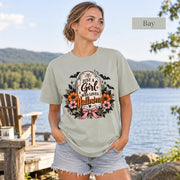 Just a Girl Who Loves Halloween T-shirt in bay featuring a floral tombstone design with bats, orange and pink flowers, hearts, sparkles, and a pink bow.