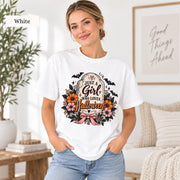 Just a Girl Who Loves Halloween T-shirt in white featuring a floral tombstone design with bats, orange and pink flowers, hearts, sparkles, and a pink bow.