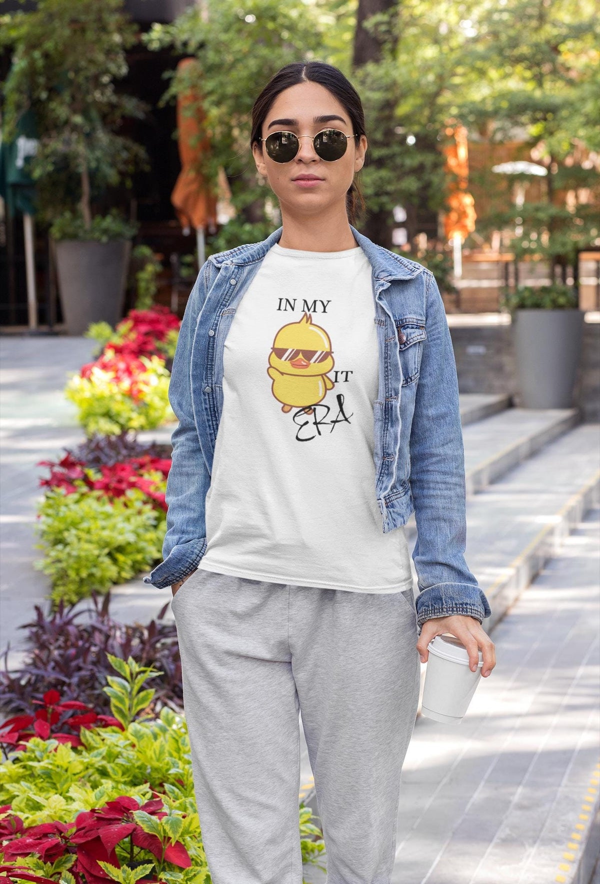 May include: White t-shirt with a cartoon chick wearing sunglasses and the text "In my era it's"