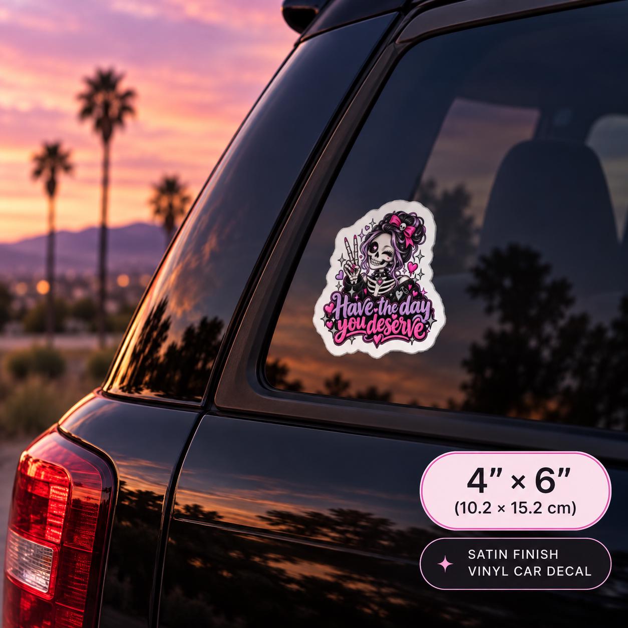 4x6 inch satin finish car decal mockup showing the gothic skeleton design on a dark SUV window with pink sunset background.