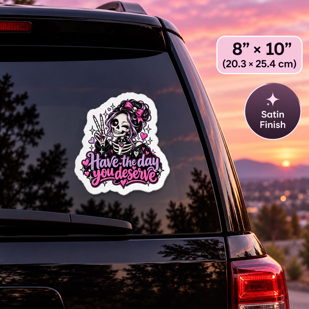 8x10 inch satin finish vinyl decal mockup showing the pink and purple gothic skeleton design displayed on a car window at sunset.