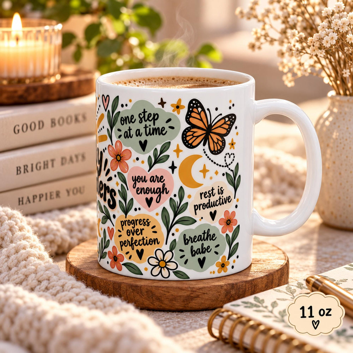 Daily Reminders ceramic mugs in 15 oz featuring colorful floral, sunshine, heart, and moon artwork with positive self-care phrases including drink water, be kind to yourself, you are enough, one step at a time, and progress over perfection.