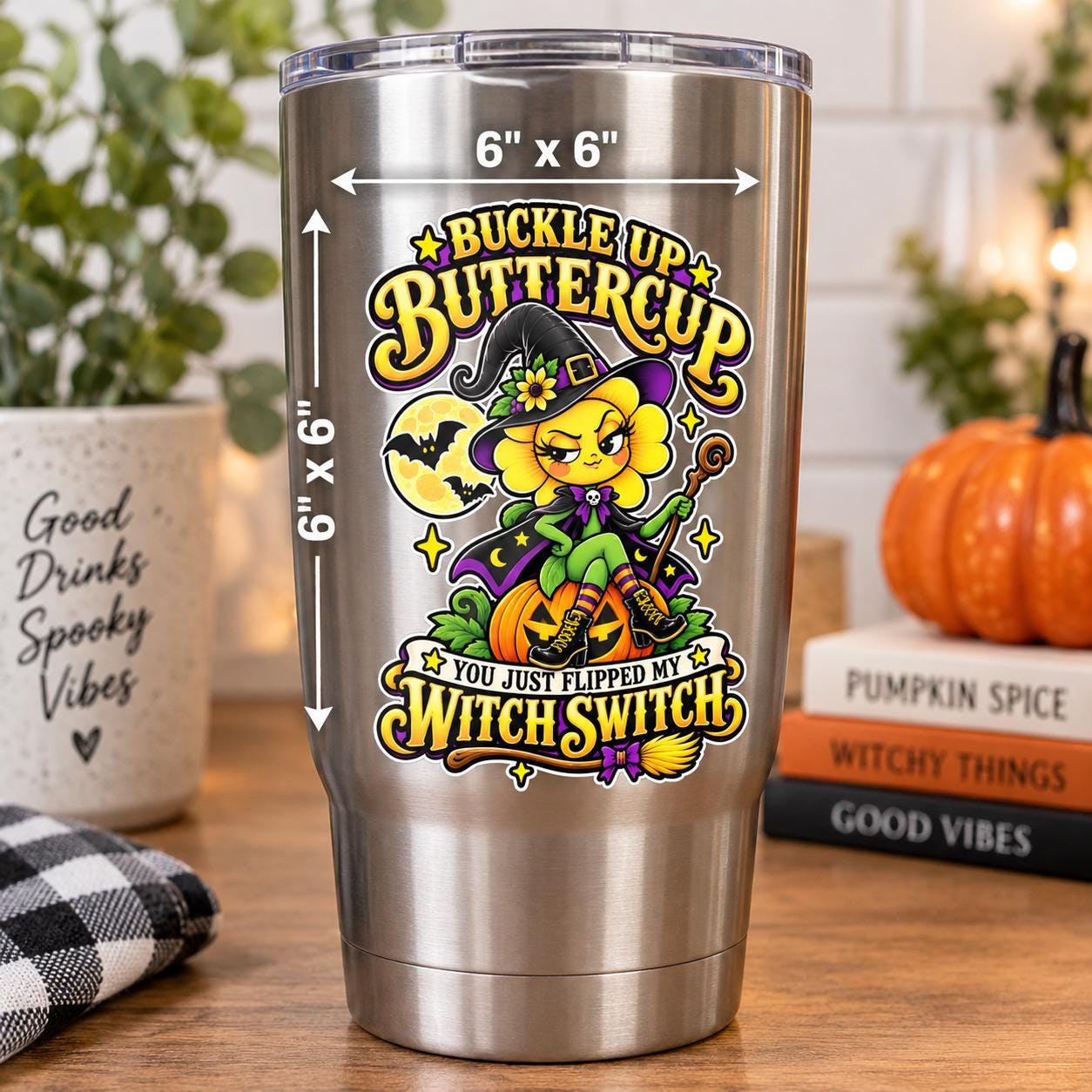 6x6 inch Buckle Up Buttercup UV DTF sticker mockup on a stainless steel tumbler with pumpkin, moon, bats, and Witch Switch artwork.