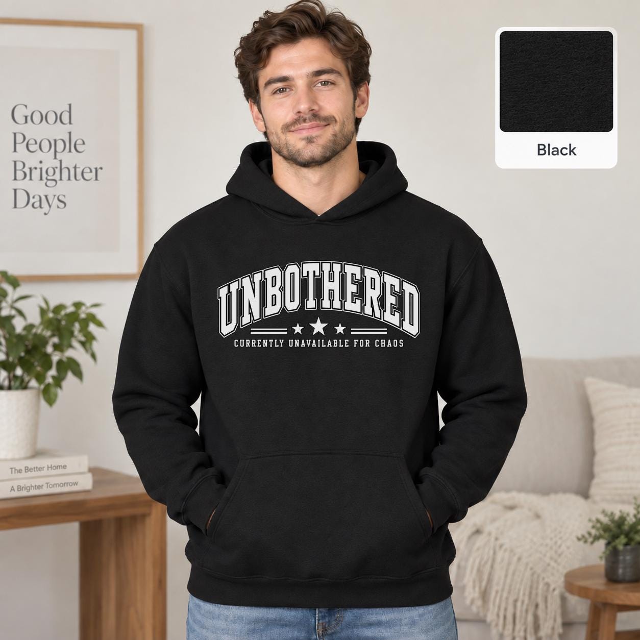 Male model wearing a black Gildan 18500 hoodie with a clean white Unbothered graphic and the phrase Currently Unavailable for Chaos, styled for a minimalist neutral aesthetic.